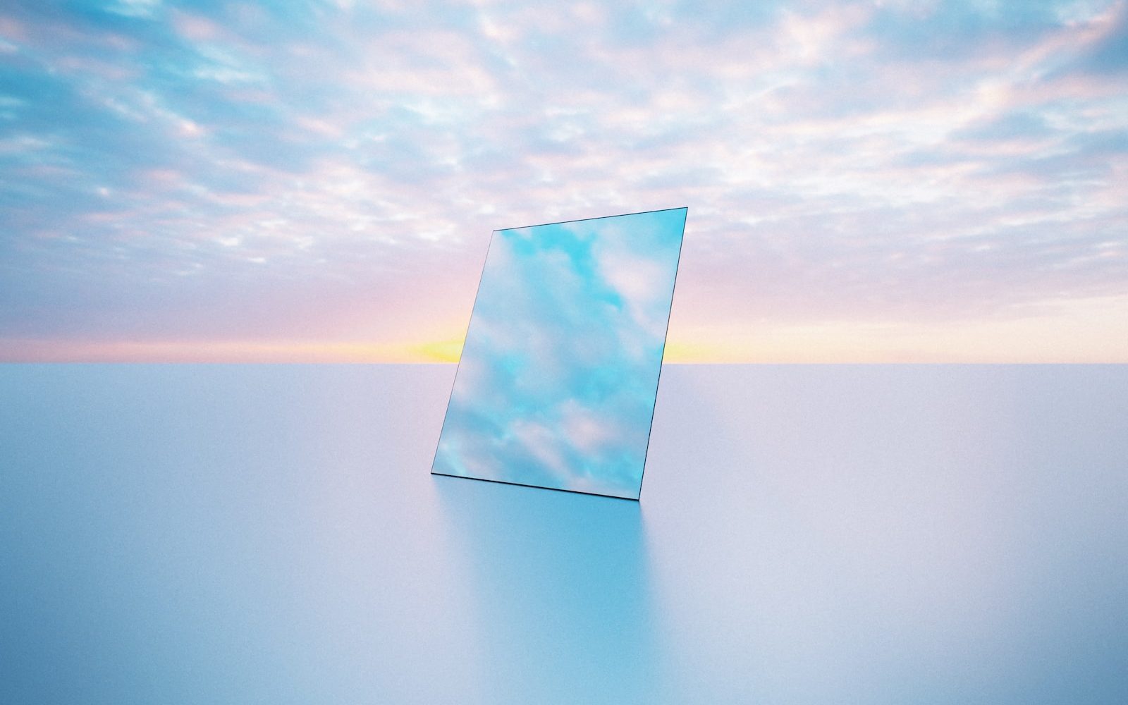 a mirror sitting on top of a table under a cloudy sky