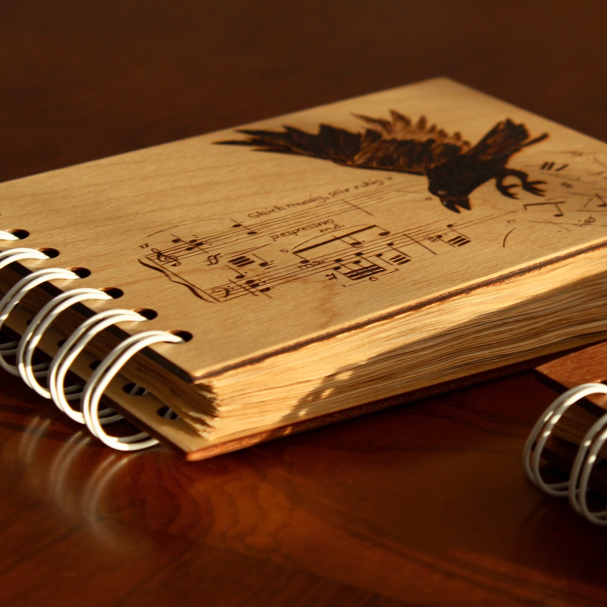 a wooden notebook with music notes on it
